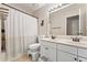Bright bathroom featuring a double sink vanity, a shower-tub combination, and neutral wall color at 2904 Masonwood Nw Dr, Kennesaw, GA 30152