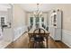 Traditional dining room featuring hardwood floors, chandelier, and windows with natural light at 2904 Masonwood Nw Dr, Kennesaw, GA 30152