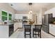 Bright kitchen with granite counters, stainless steel appliances, and a breakfast bar at 2904 Masonwood Nw Dr, Kennesaw, GA 30152