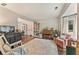 Bright living room with hardwood floors, a large bay window, and a comfortable seating area at 2904 Masonwood Nw Dr, Kennesaw, GA 30152
