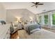 Serene main bedroom boasts hardwood floors, vaulted ceilings, and plenty of natural light at 2904 Masonwood Nw Dr, Kennesaw, GA 30152