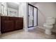 Bathroom featuring updated shower, tile floors and granite countertop at 4347 Lanier Ridge Walk # 1501, Cumming, GA 30041