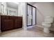 Bathroom with granite countertops, glass shower, and tiled floor at 4347 Lanier Ridge Walk # 1501, Cumming, GA 30041