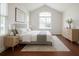 Bright bedroom with large window, vaulted ceiling, plush rug, and stylish decor at 4347 Lanier Ridge Walk # 1501, Cumming, GA 30041