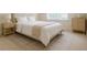 Comfortable bedroom with neutral tones, a plush bed, and ample natural light at 4347 Lanier Ridge Walk # 1501, Cumming, GA 30041