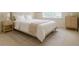Comfortable bedroom with a neutral palette and light wood furniture at 4347 Lanier Ridge Walk # 1501, Cumming, GA 30041