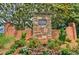 Brookhaven at Lanier Ridge entrance featuring stone monument, brick accents, and colorful flowers, welcomes residents and guests at 4347 Lanier Ridge Walk # 1501, Cumming, GA 30041