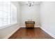 Elegant dining room bathed in natural light with hardwood floors and classic chandelier at 4347 Lanier Ridge Walk # 1501, Cumming, GA 30041