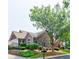 Charming stone and brick home with mature trees and well-maintained landscaping at 4347 Lanier Ridge Walk # 1501, Cumming, GA 30041