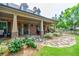 Charming front porch with stone pathway, brick columns, and cozy seating at 4347 Lanier Ridge Walk # 1501, Cumming, GA 30041