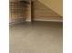 Clean garage with epoxy flooring and organized wall-mounted shelving for optimal storage at 4347 Lanier Ridge Walk # 1501, Cumming, GA 30041
