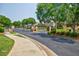 Gated community entrance featuring brick pillars and mature trees enhancing privacy at 4347 Lanier Ridge Walk # 1501, Cumming, GA 30041