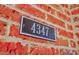 Close-up of the house number '4347' on a weathered brick wall at 4347 Lanier Ridge Walk # 1501, Cumming, GA 30041