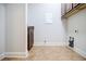 A spacious laundry room featuring wood cabinets and tile flooring at 4347 Lanier Ridge Walk # 1501, Cumming, GA 30041