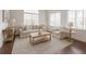 Bright living room with neutral furniture and hardwood floors at 4347 Lanier Ridge Walk # 1501, Cumming, GA 30041