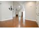 Spacious living room with hardwood floors, vaulted ceilings, a fireplace, and plenty of natural light at 4347 Lanier Ridge Walk # 1501, Cumming, GA 30041