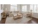 Bright and elegant living room with neutral palette, hardwood floors and large windows at 4347 Lanier Ridge Walk # 1501, Cumming, GA 30041