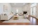 Bright and airy living room featuring a fireplace, hardwood floors, and ample seating at 4347 Lanier Ridge Walk # 1501, Cumming, GA 30041