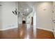 Open living room featuring hardwood floors, fireplace, and vaulted ceiling at 4347 Lanier Ridge Walk # 1501, Cumming, GA 30041
