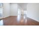 Spacious living area featuring beautiful hardwood floors and plenty of natural light at 4347 Lanier Ridge Walk # 1501, Cumming, GA 30041