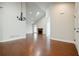 Bright, open-concept living room with hardwood floors and a cozy fireplace at 4347 Lanier Ridge Walk # 1501, Cumming, GA 30041