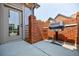 Private patio with brick wall and gas grill, perfect for outdoor cooking at 4347 Lanier Ridge Walk # 1501, Cumming, GA 30041