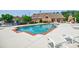 Community pool featuring a spacious sun deck with ample lounge chairs, ideal for relaxation and recreation at 4347 Lanier Ridge Walk # 1501, Cumming, GA 30041