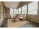 Enclosed sunroom filled with lots of light and features cozy seating at 4347 Lanier Ridge Walk # 1501, Cumming, GA 30041