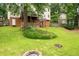 Expansive backyard with a deck, fire pit, and mature trees creating a private and inviting outdoor space at 4497 Windsor Oaks Dr, Marietta, GA 30066