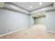 Spacious basement area with neutral-toned walls and carpeting, ready for customization at 4497 Windsor Oaks Dr, Marietta, GA 30066
