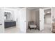 Hallway shot into the main bathroom features double doors, a vanity, and a large mirror at 4497 Windsor Oaks Dr, Marietta, GA 30066