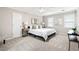 Neutral bedroom with lots of light, a large bed, and matching side tables at 4497 Windsor Oaks Dr, Marietta, GA 30066