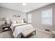 Comfortable bedroom with a neutral color scheme, soft lighting, and ample natural light at 4497 Windsor Oaks Dr, Marietta, GA 30066