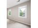 Bright bedroom featuring two windows and neutral walls, perfect for personalization at 4497 Windsor Oaks Dr, Marietta, GA 30066