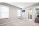 Empty bedroom leading to hallway with bathroom and hardwood flooring at 4497 Windsor Oaks Dr, Marietta, GA 30066