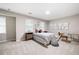 Cozy bedroom with gray carpet, two windows, and a writing desk with a modern chair at 4497 Windsor Oaks Dr, Marietta, GA 30066