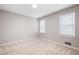 Empty bedroom features neutral walls, carpeting, and two windows with blinds at 4497 Windsor Oaks Dr, Marietta, GA 30066