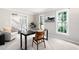 Elegant home office with classic furniture, soft carpet, and natural light from large windows at 4497 Windsor Oaks Dr, Marietta, GA 30066