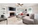 Comfortable living room features a brick fireplace, custom built-ins, and a large sectional sofa at 4497 Windsor Oaks Dr, Marietta, GA 30066