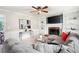 Bright living room with fireplace, large sectional, and views through the doorway at 4497 Windsor Oaks Dr, Marietta, GA 30066
