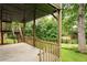 Covered patio with natural wood elements and a view of lush greenery at 4497 Windsor Oaks Dr, Marietta, GA 30066