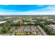Aerial view of the neighborhood with the pond, pool, and nearby business district at 1099 Heyward Way, Alpharetta, GA 30009