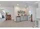 Entertaining area with wet bar, sink, and shelving for glasses and accessories at 1099 Heyward Way, Alpharetta, GA 30009