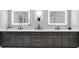 Modern bathroom vanity featuring double sinks, sleek black hardware, and illuminated mirrors for a luxurious feel at 1099 Heyward Way, Alpharetta, GA 30009