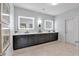 Bathroom with double vanity, modern lights, tile floor, and plenty of counter space at 1099 Heyward Way, Alpharetta, GA 30009