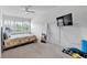 Comfortable bedroom with a ceiling fan, a sloped ceiling, and large windows offering plenty of natural light at 1099 Heyward Way, Alpharetta, GA 30009