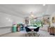 Bright bonus room features shiplap wall, chandelier, and custom built-in bookcases for ample storage at 1099 Heyward Way, Alpharetta, GA 30009