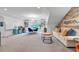 Open bonus room featuring a sitting area with office/study area and built-in bookcases, perfect for relaxing or working at 1099 Heyward Way, Alpharetta, GA 30009