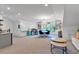 Spacious bonus room with shiplap wall, built-in bookcases, and large windows providing plenty of natural light at 1099 Heyward Way, Alpharetta, GA 30009