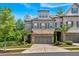 Beautifully landscaped home with stone accents, attached two-car garage, and charming curb appeal at 1099 Heyward Way, Alpharetta, GA 30009